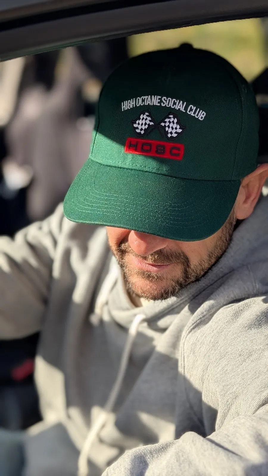 Racing Green Cap worn in the driver's seat