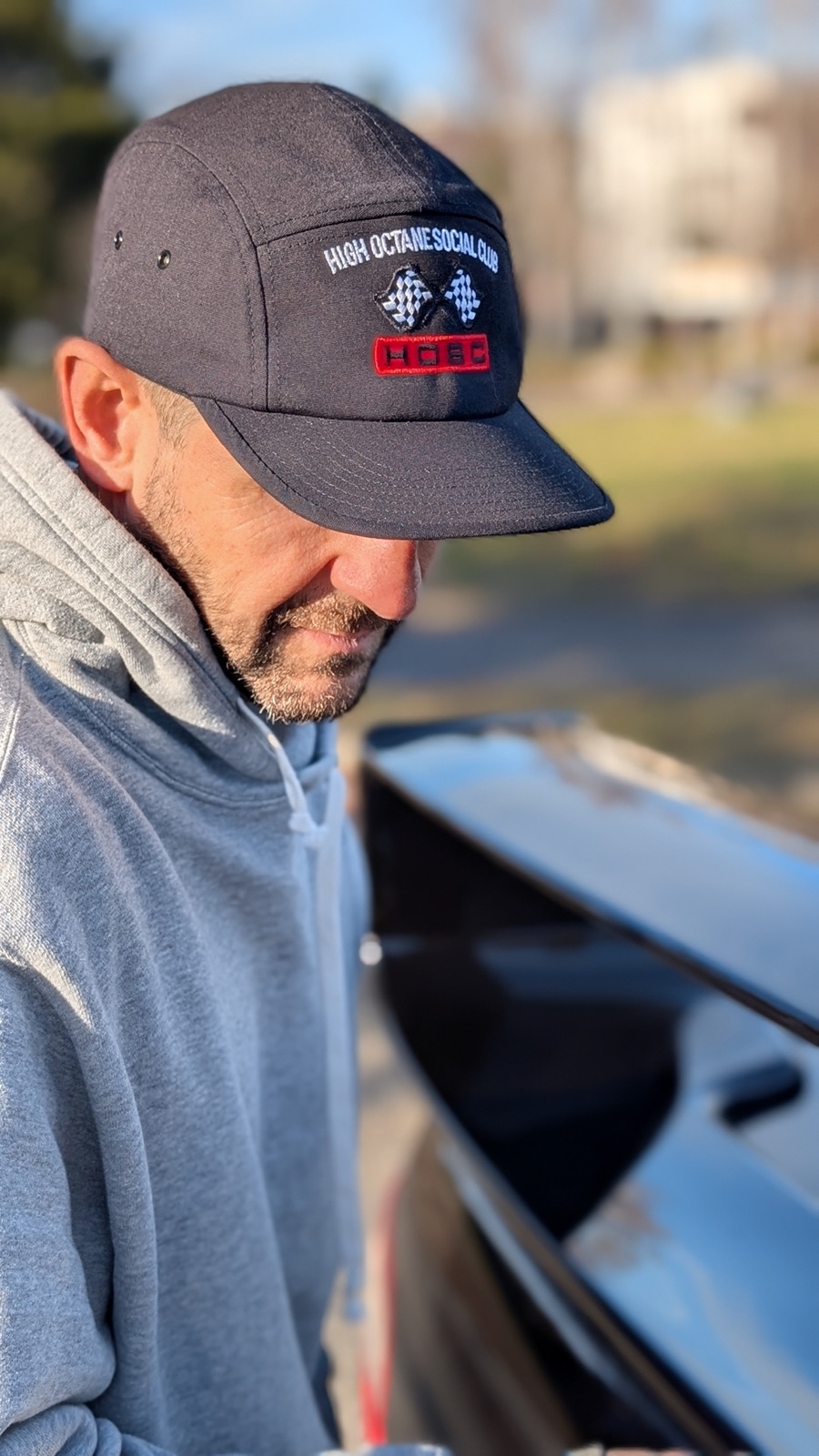 Five-Panel Cap worn, looking down at a black bonnet