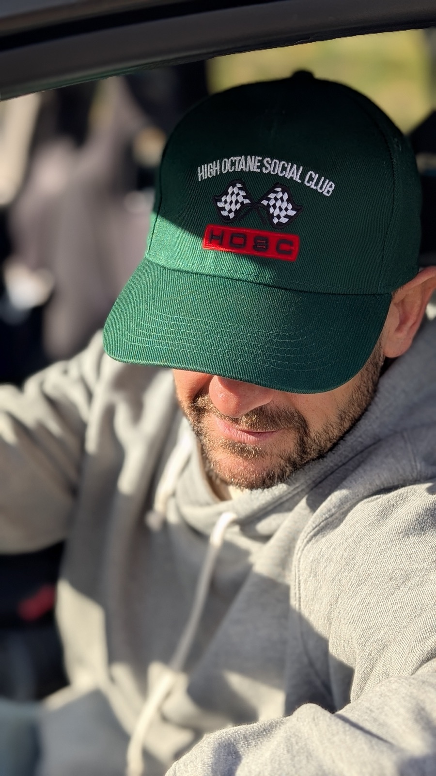 Racing Green Cap worn in the driver's seat